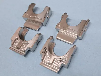 Precision CNC milled 304 stainless steel jaw sets with identification engraving for a pneumatic hose assembly tool