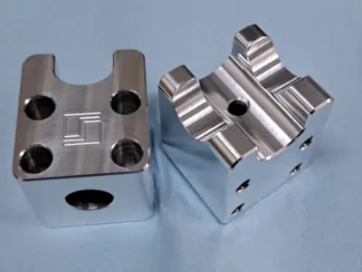 Precision CNC machined 6061 aluminum mounting brackets with engraved logo